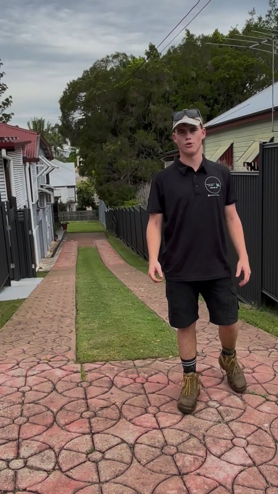 Cooper from Moorooka Cuts walking along a freshly mowed lawn strip